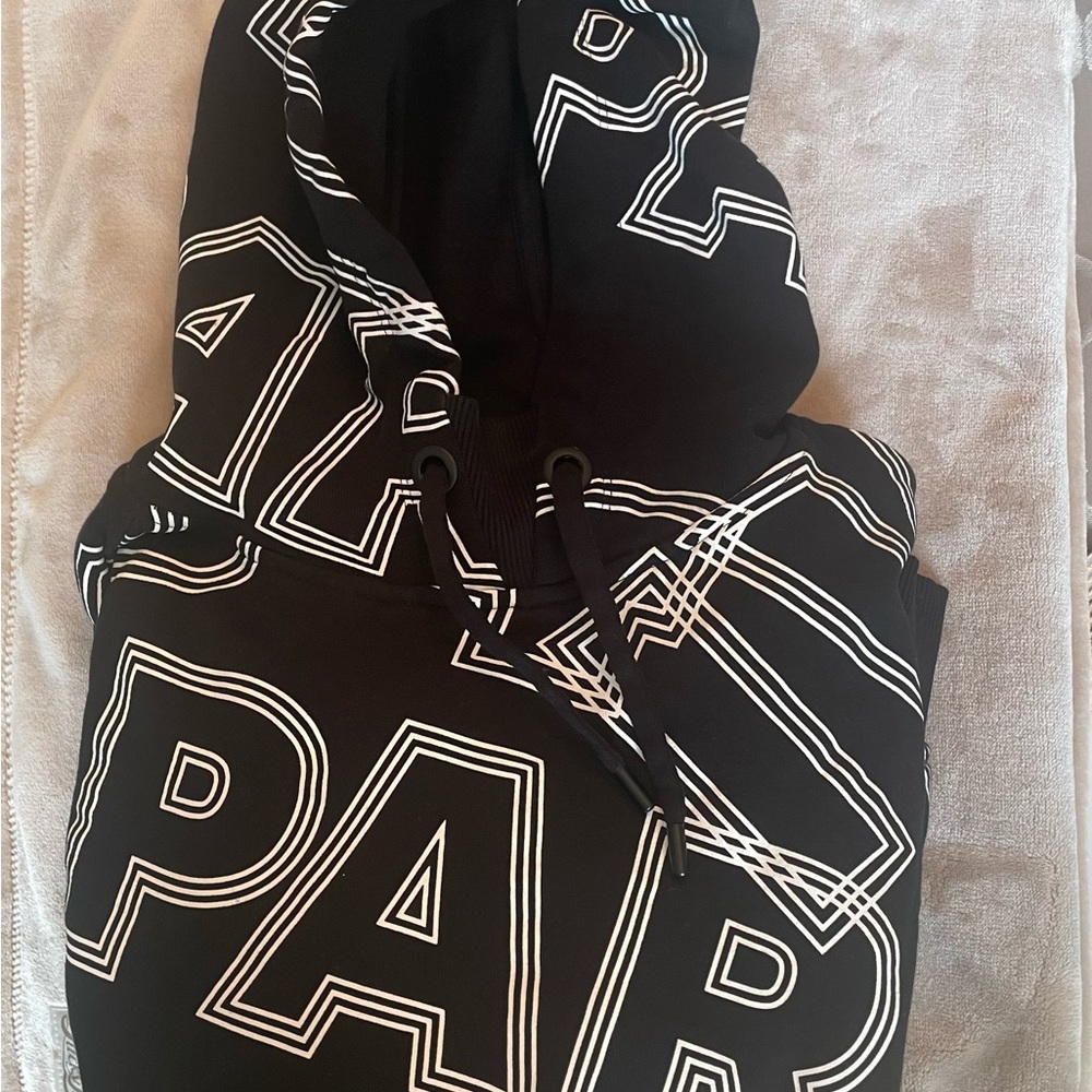 Authentic Ivy Park by Beyoncé, black hoodie with white abstract lettering.